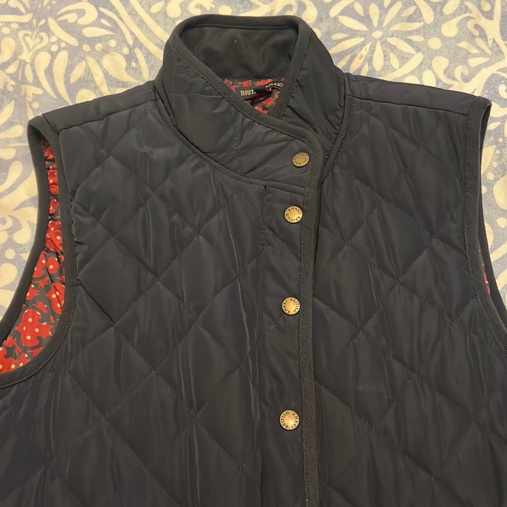 Navy vest with gold buttons